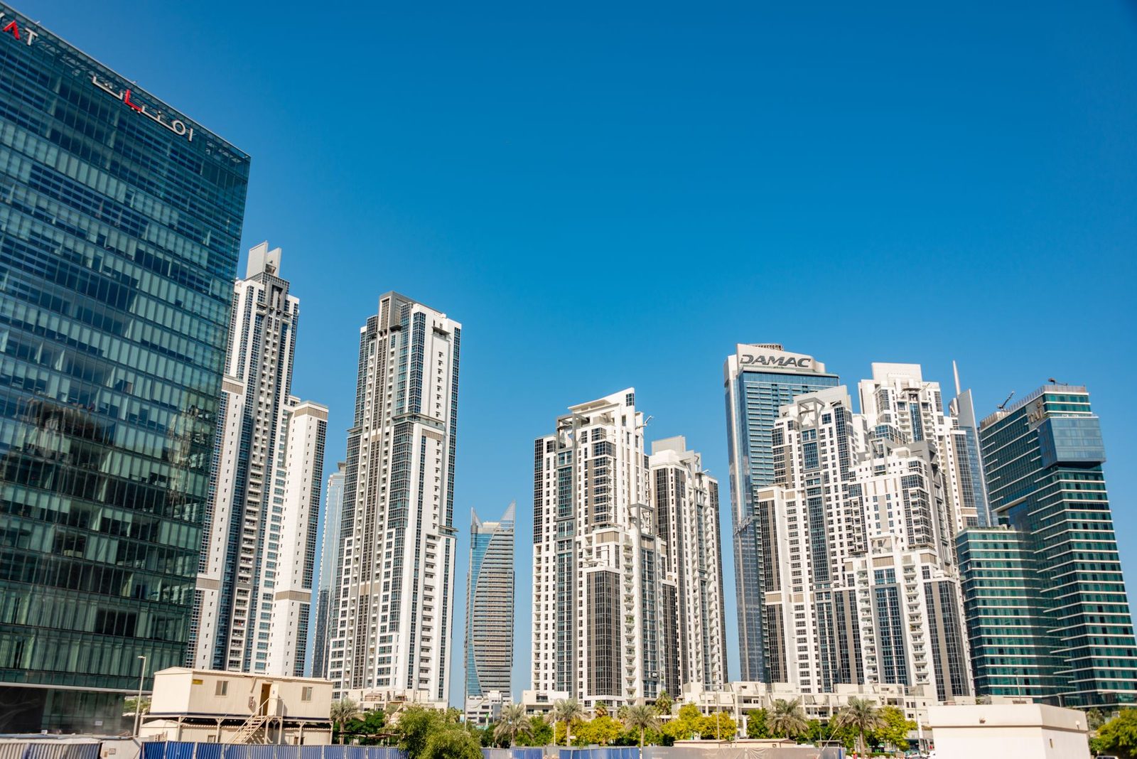 Modern Dubai skyscrapers under a clear blue sky
